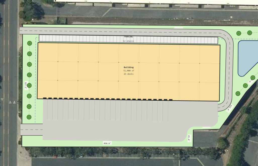 Plan view of an irregular industrial site with a dock group and an offset truck court set into a jog in the building line